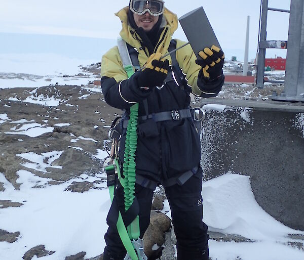 A man ready to climb a mast