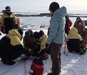 A group of people build a hauling system