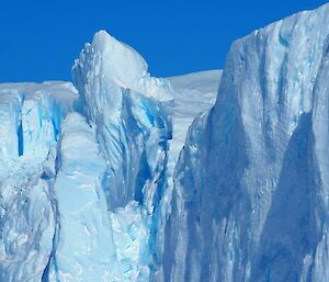 The many blues of an iceberg on a sunny day