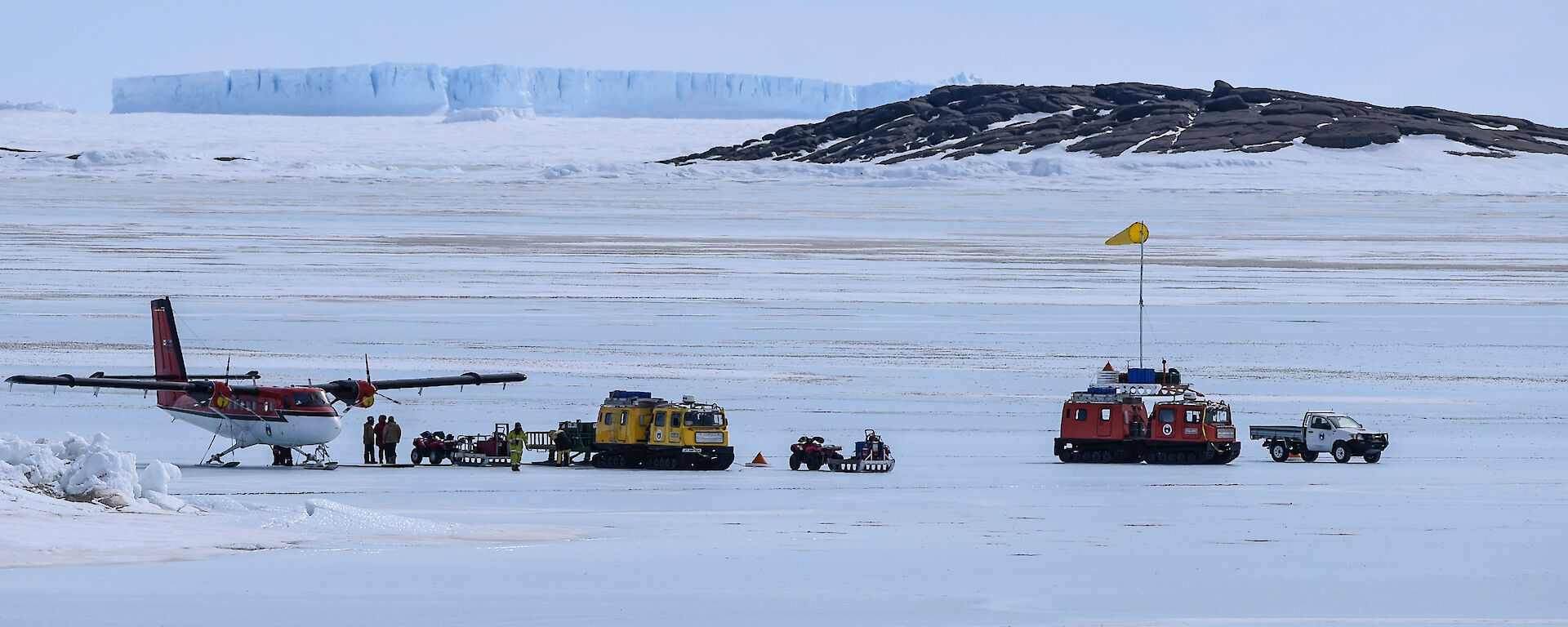 Looking back to Team Aviation from Mawson station, icebergs in background
