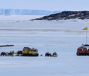 Looking back to Team Aviation from Mawson station, icebergs in background