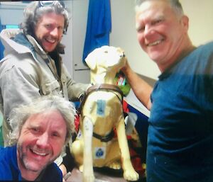 Three men and a guide dog