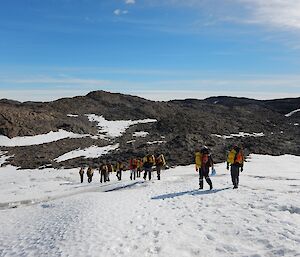 A group of expeditioners in the rocky Vestfold Hills undertaking navigation training.