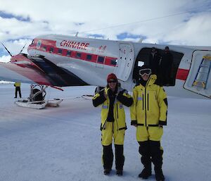 Sue Cook (left) and Tom Schaap standing beside a Chinese Basler aircraft at Davis.