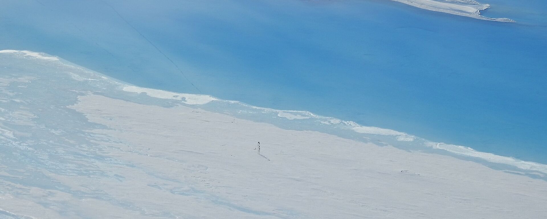 Aerial photo showing a lake monitoring tower is now standing right at the lake’s edge on the Sørsdal Glacier.