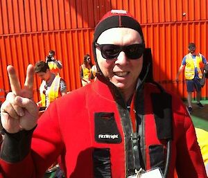 Dr Rob Massom wearing an immersion suit on the deck of the Aurora Australis.