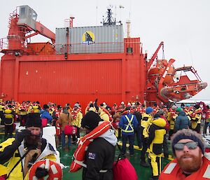 Expeditioners muster on the heli-deck.