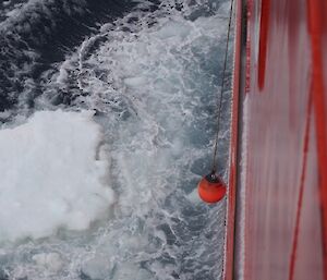 The ice thickness meter – a buoy (45cm in diameter) attached to the side of the Aurora Australis.