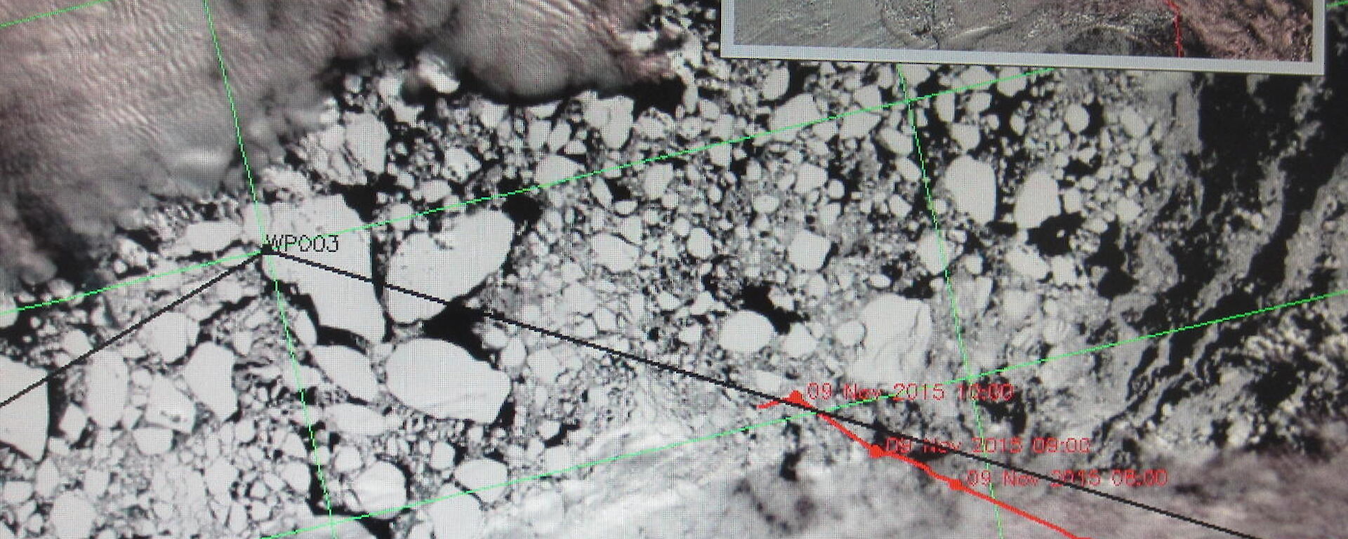 Screenshot of a satellite image of Antarctic sea ice with the proposed vessel trajectory (black line) and the actual vessel track (red line).