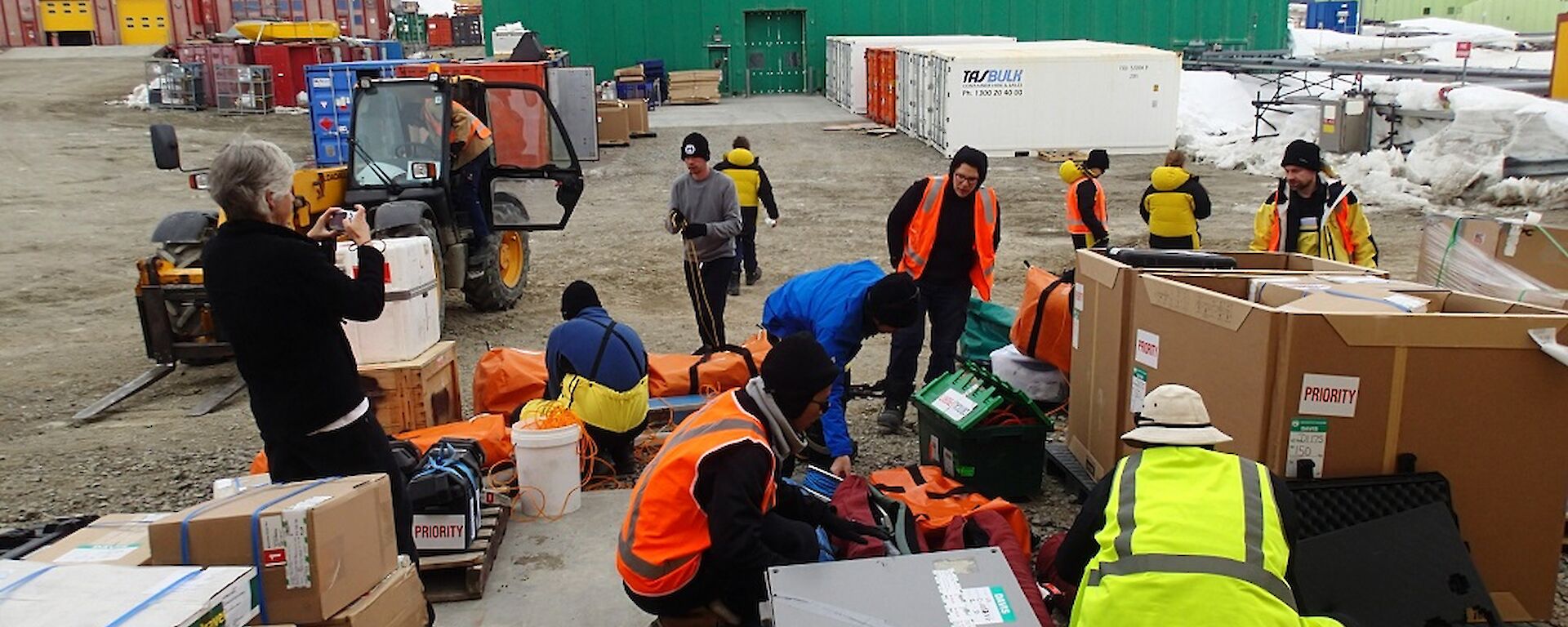 The fast-ice team unload their science gear container at Davis station.