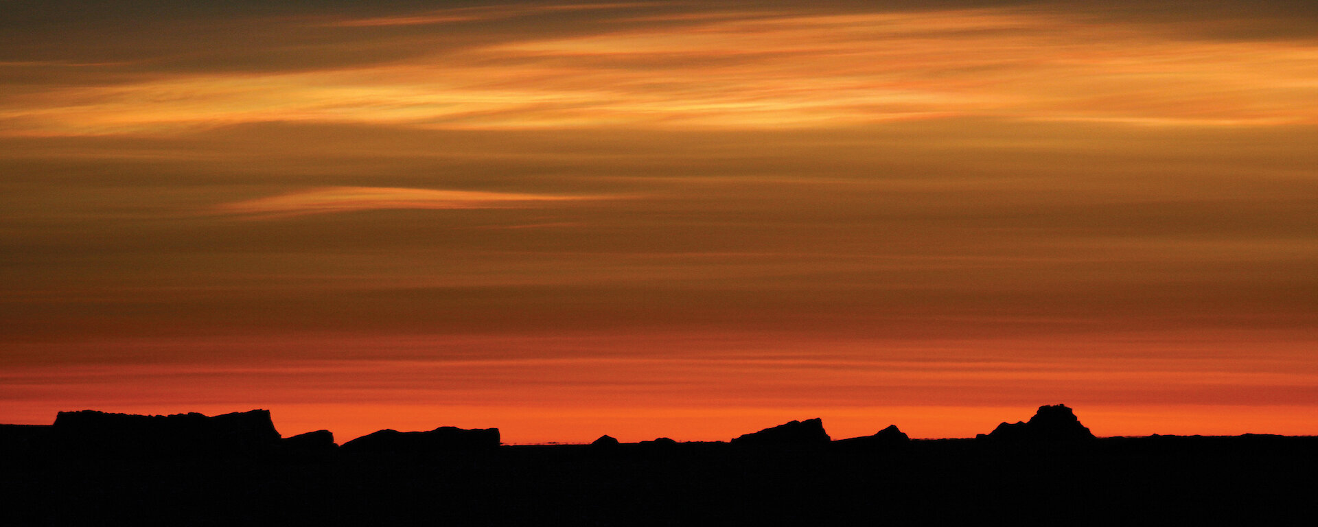 Stratospheric clouds, seen here illuminated by the sun during twilight.