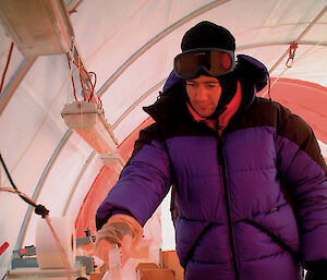 Dr Mark Curran processes an ice core at Law Dome.