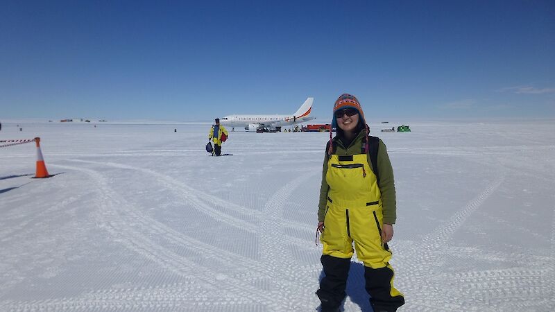 Scientist, Mana Inoue, on the Wilkins Runway airstrip with the aircraft behind