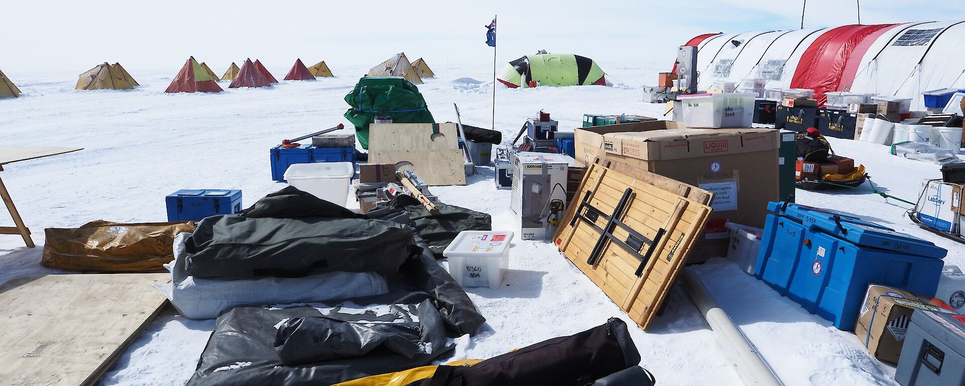 A collection of equipment packed into bags and boxes.