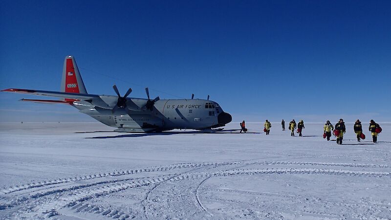 Passengers, including the ocean acidification team, unloading from the first C130 (Hercules) on the skiway near Casey on Wednesday 12 November 2014