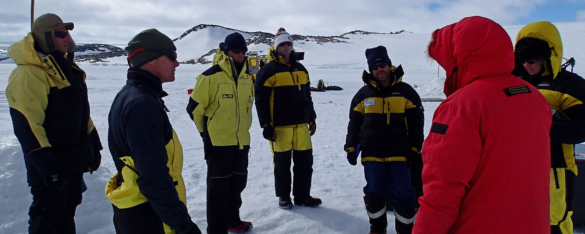 Members of the experimental team meet to discuss deployment of a chamber duct