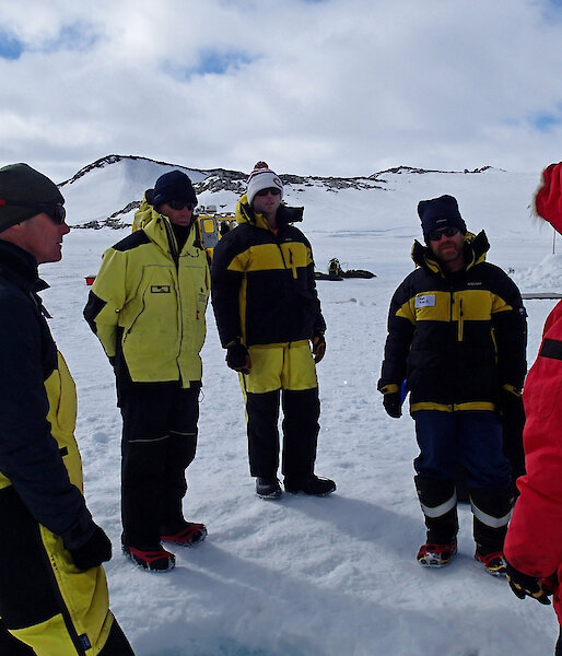 Members of the experimental team meet to discuss deployment of a chamber duct