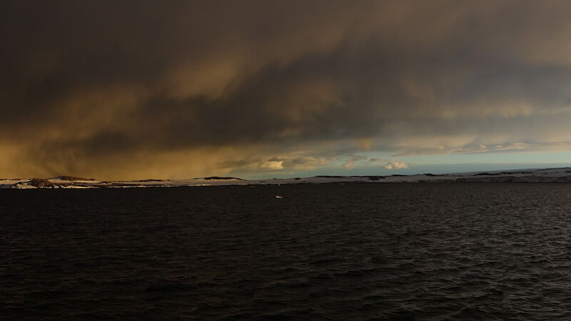 Storm clouds gather over the Windmill Islands, near the site of the carbon enrichment experiment at Casey station