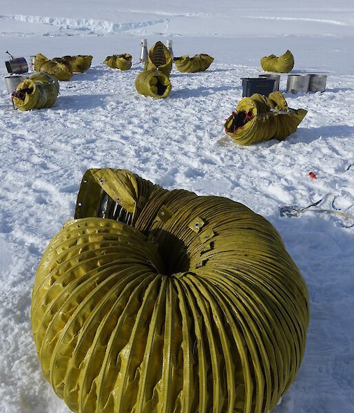 The yellow ducting dismantled into its original 10m long sections and tied up on the sea ice, ready to be transported back to station