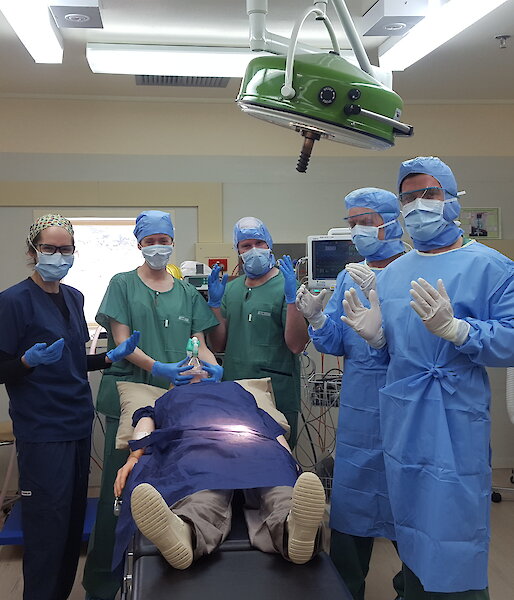 Group of medical assistants and doctor in surgery
