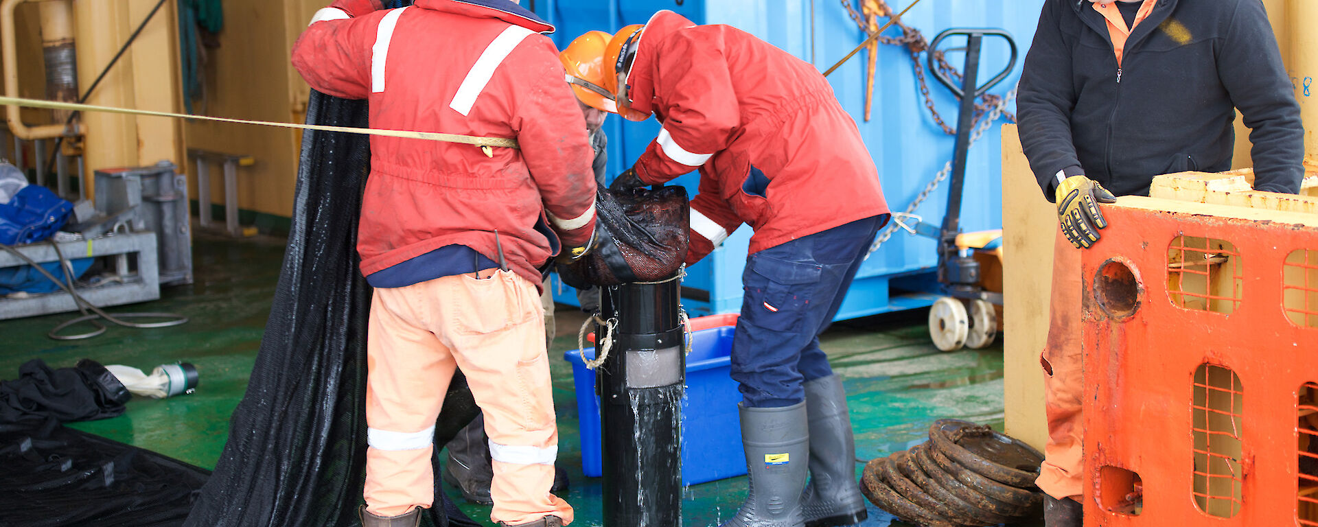 Scientists and crew empty the krill net during the K-Axis voyage.