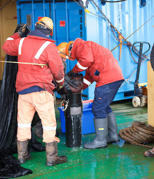 Scientists and crew empty the krill net during the K-Axis voyage.