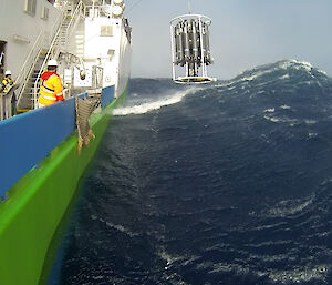 The trace metal rosette being retrieved from the ocean in a huge swell.