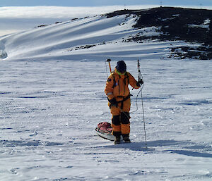 Dr Petra Heil measuring and recording snow depth and GPS position using a GPS-MagnaProbe device.