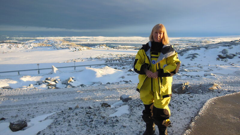 Gwen standing near a pipeline at Casey station.