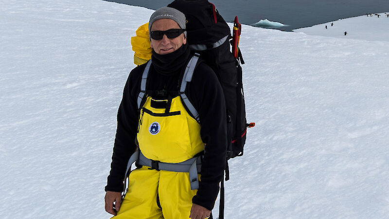 Dr Nick Gales with a pack in the field near Casey research station.