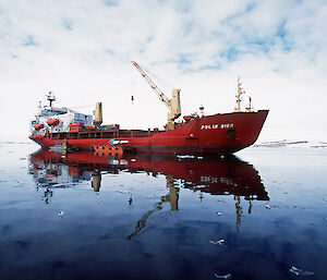 The Ice Bird, now the Polar Bird, anchored in a bay in Antarctica.