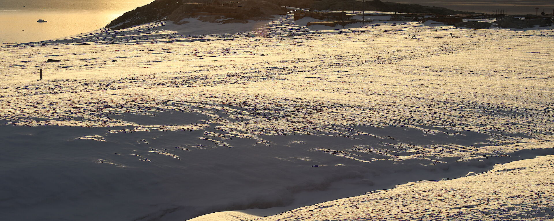 Sunset over the icy landscape near the old Wilkes station.