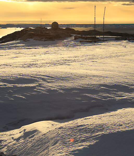 Sunset over the icy landscape near the old Wilkes station.