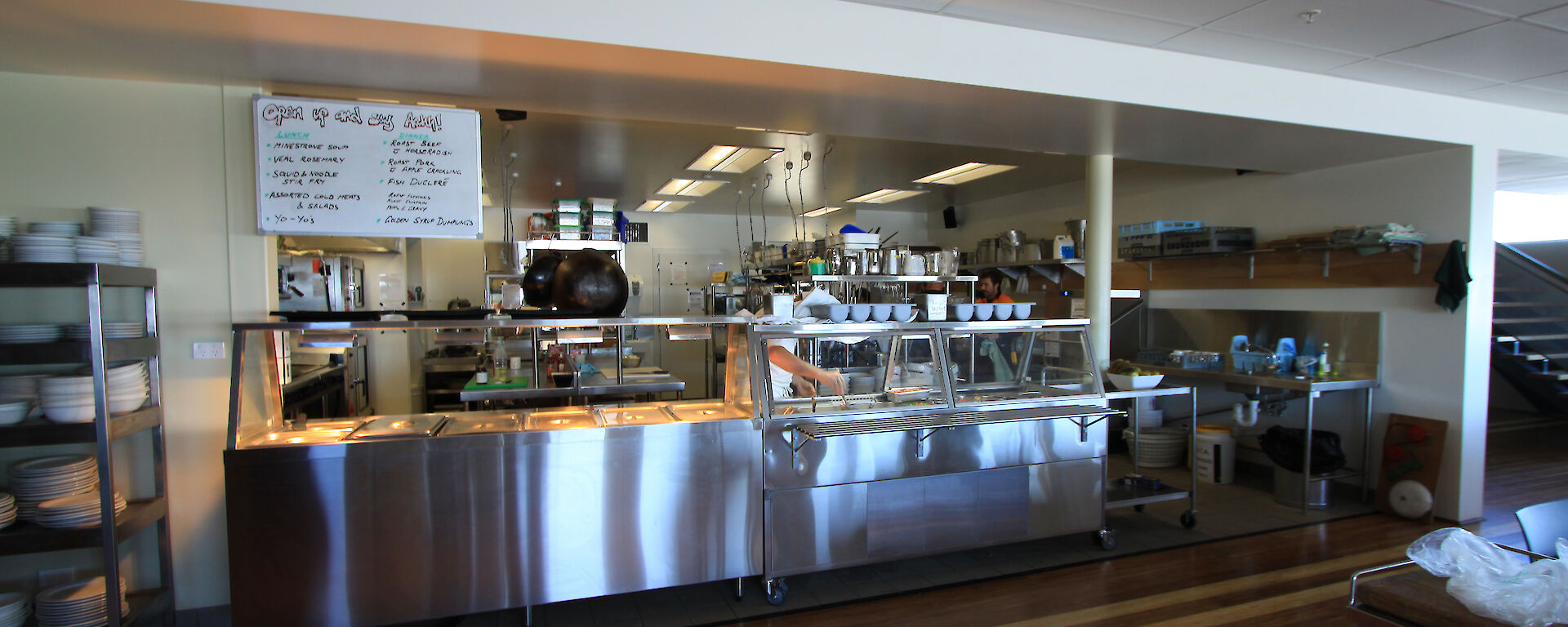 A modern stainless steel kitchen showing the buffet area