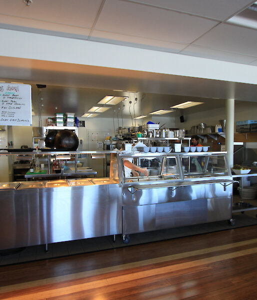 A modern stainless steel kitchen showing the buffet area