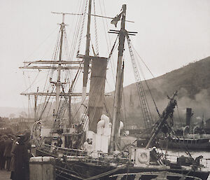 Black and white photo of the Aurora tied up at Port Chalmers in Dunedin, New Zealand in 1916.