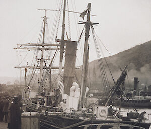 Black and white photo of the Aurora tied up at Port Chalmers in Dunedin, New Zealand in 1916.