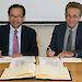 Australian Antarctic Division Director Nick Gales (right) and Dr Kang Joon Seog of the South Korean National Institute of Fisheries Science, signing the Memorandum of Understanding on non-lethal whale research.