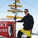 Dr Nick Gales in front of a sign at Casey research station.