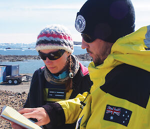 Phil Harper discusses the script for a scene on the Sørsdal Glacier with glaciologist Sarah Thompson, from the University of Swansea in the UK.