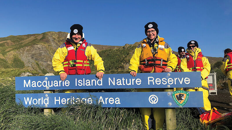 David and Madeleine Rayward in tussock grass on Macquarie Island.