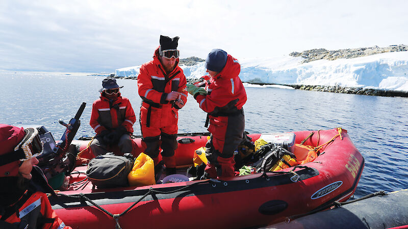 A group of researchers in a rubber boat off the coast of Casey.
