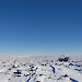 Adams Flat — a sediment filled valley covered in snow.