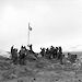 Heard Island expedition leader, Stuart Campbell, raising the Australian flag claiming sovereignty for Australia, and declaring the station at Atlas Cove open.