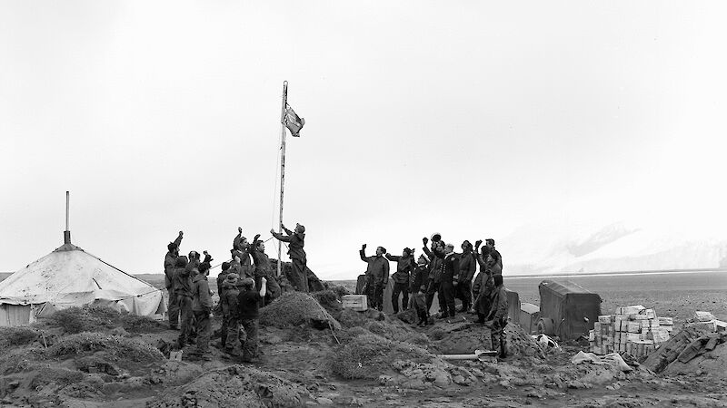 Heard Island expedition leader, Stuart Campbell, raising the Australian flag claiming sovereignty for Australia, and declaring the station at Atlas Cove open.