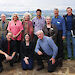 Geoscience Australia’s Antarctic field notebook citizen scientist transcribers and retired Antarctic geologists posing for a photo.