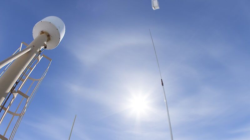 Juarez Viegas from the US Atmospheric Radiation Measurement program launches a radiosonde from the deck of the Aurora Australis.