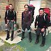 The Macquarie Island field hut assessment team of Paul Farrow (left), Dr Aleks Terauds and Ben Wood from VEC Civil Engineering (right), dressed in hiking gear and packs, outside a hut.