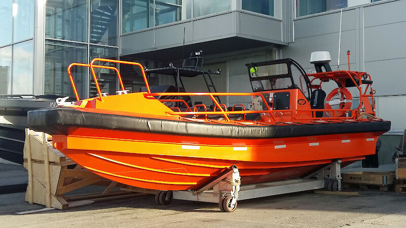 One of three personnel transfer tenders, on a trailer.