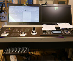 The ship’s dynamic positioning system console.